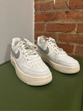 Nike White and Cream Leather Air Force One Sneakers with Silver Metallic Swoosh